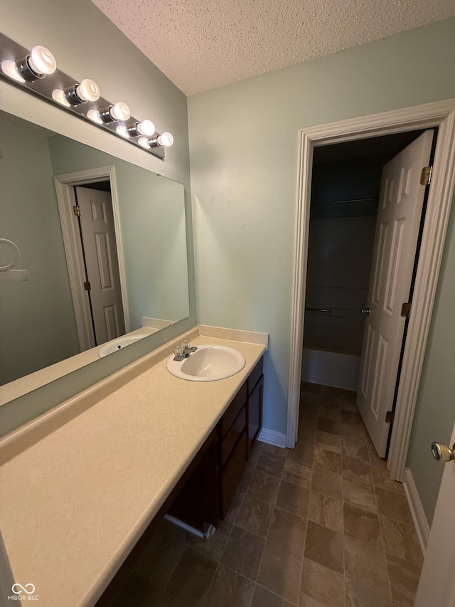 14171 Refreshing Garden Ln, Fishers, IN 46038 - bathroom featuring vanity and a textured ceiling
