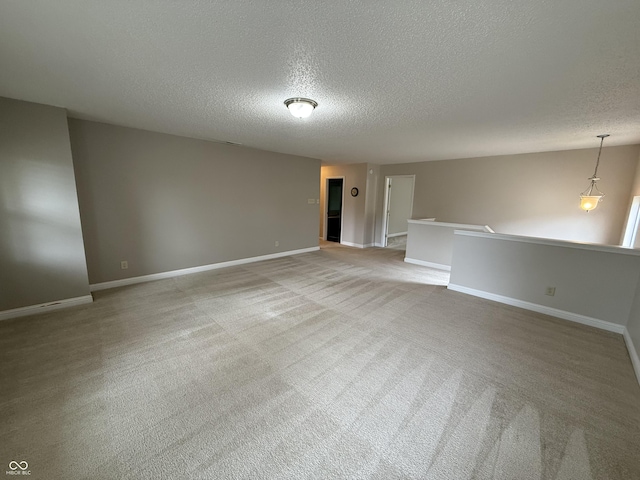 14171 Refreshing Garden Ln, Fishers, IN 46038 - empty room featuring a textured ceiling and light carpet