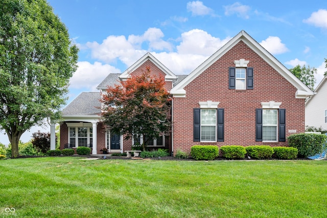 10931 Hidden Hollow Ct, Fishers, IN 46037 - traditional-style home with brick siding and a front lawn