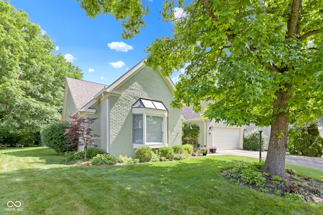 1114 Clairborne Ct, Indianapolis, IN 46280 - view of front of home with brick siding, concrete driveway, a front yard, and roof with shingles
