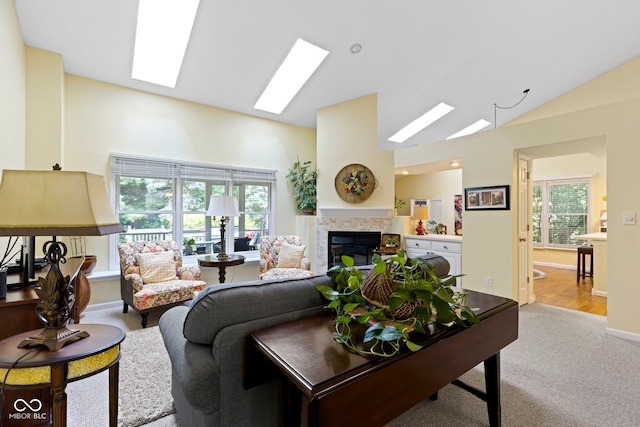 1114 Clairborne Ct, Indianapolis, IN 46280 - living room with a fireplace, a skylight, carpet flooring, and high vaulted ceiling