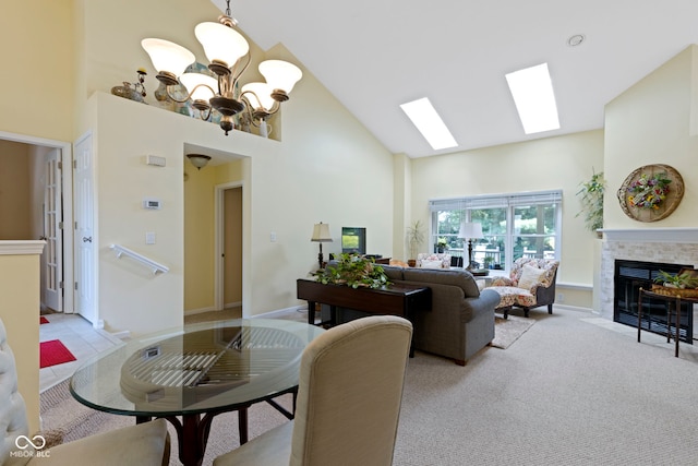 1114 Clairborne Ct, Indianapolis, IN 46280 - living area featuring high vaulted ceiling, a chandelier, a fireplace with flush hearth, and a skylight