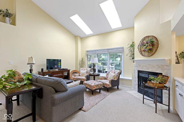 1114 Clairborne Ct, Indianapolis, IN 46280 - living room with high vaulted ceiling, light carpet, a tile fireplace, and a skylight