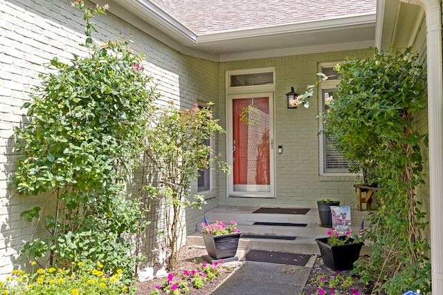 1114 Clairborne Ct, Indianapolis, IN 46280 - property entrance featuring roof with shingles and brick siding