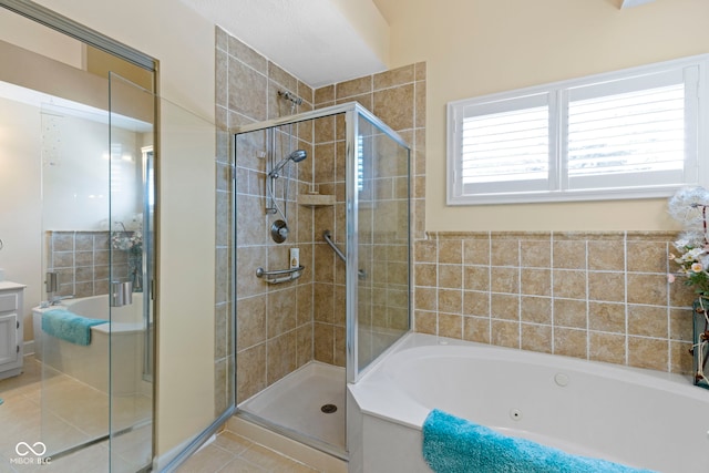 1114 Clairborne Ct, Indianapolis, IN 46280 - bathroom featuring a tub with jets, a shower stall, tile patterned flooring, and vanity