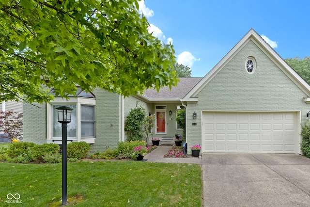 1114 Clairborne Ct, Indianapolis, IN 46280 - view of front of house with brick siding, an attached garage, concrete driveway, and a front lawn