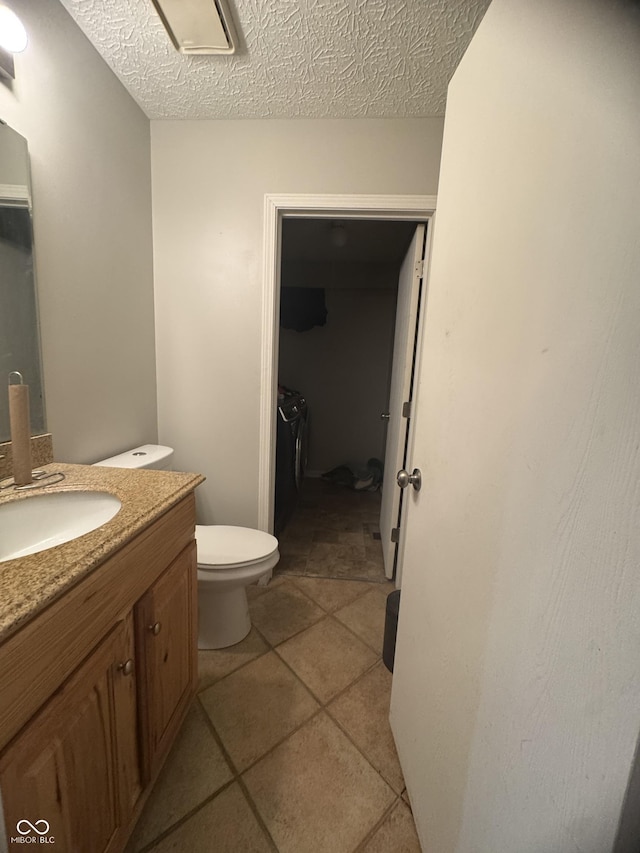 4030 Hollow Creek Dr, Indianapolis, IN 46268 - half bathroom featuring vanity, a textured ceiling, and tile patterned floors