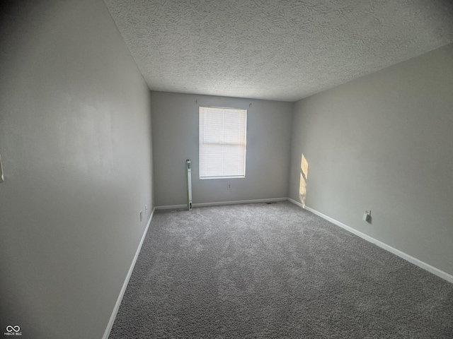 4030 Hollow Creek Dr, Indianapolis, IN 46268 - carpeted empty room featuring baseboards and a textured ceiling