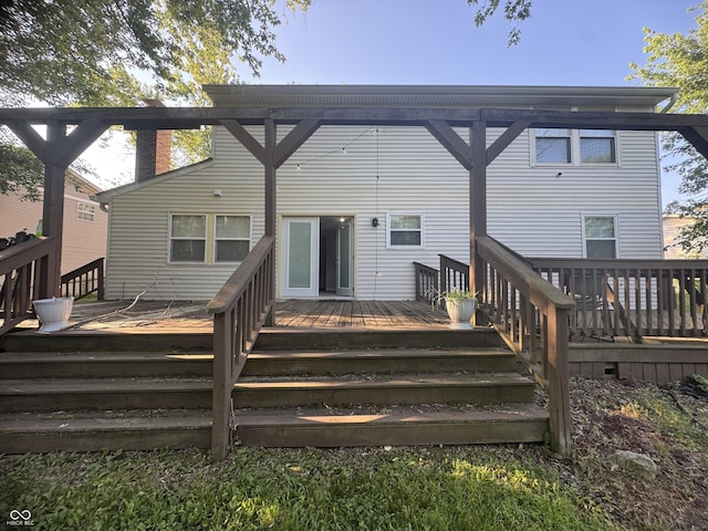 4030 Hollow Creek Dr, Indianapolis, IN 46268 - back of property with a deck and a chimney
