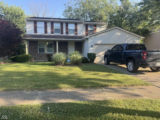 4030 Hollow Creek Dr, Indianapolis, IN 46268 - view of front facade featuring an attached garage, brick siding, a front lawn, and concrete driveway