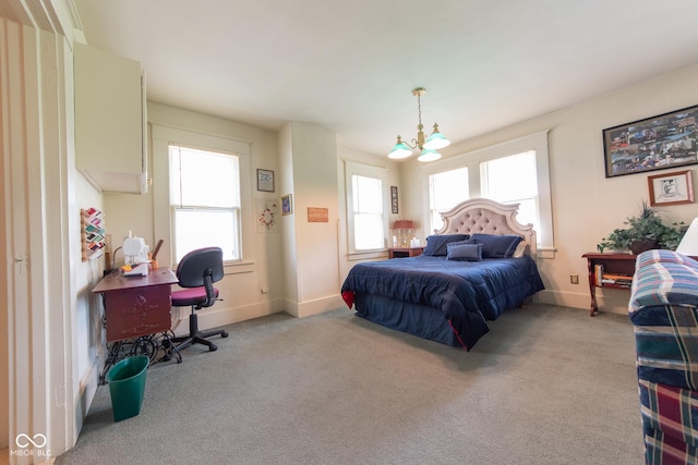 1022 Franklin St, Columbus, IN 47201 - carpeted bedroom with a chandelier and an office area