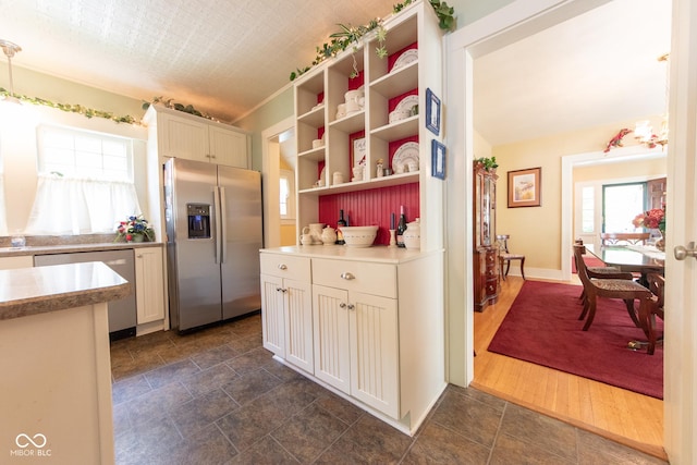 1022 Franklin St, Columbus, IN 47201 - kitchen with stainless steel appliances, open shelves, light countertops, and white cabinets