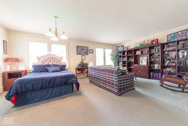 1022 Franklin St, Columbus, IN 47201 - bedroom featuring carpet floors and a chandelier