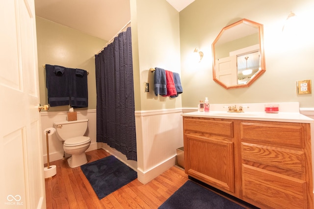 1022 Franklin St, Columbus, IN 47201 - full bathroom with wood finished floors, a wainscoted wall, and vanity