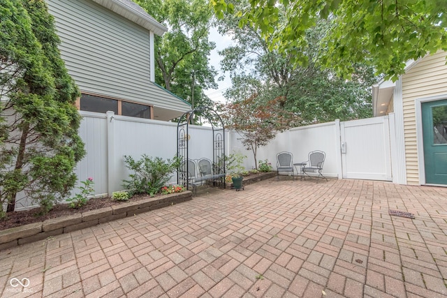 1022 Franklin St, Columbus, IN 47201 - fenced backyard with a patio and a gate