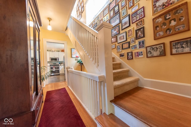 1022 Franklin St, Columbus, IN 47201 - stairs featuring wood finished floors and baseboards