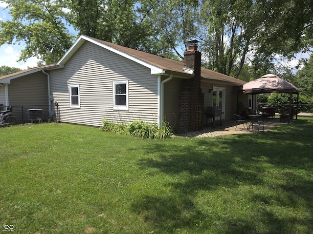 8401 Culpeper Dr, Indianapolis, IN 46227 - view of property exterior with a gazebo, a chimney, and a patio