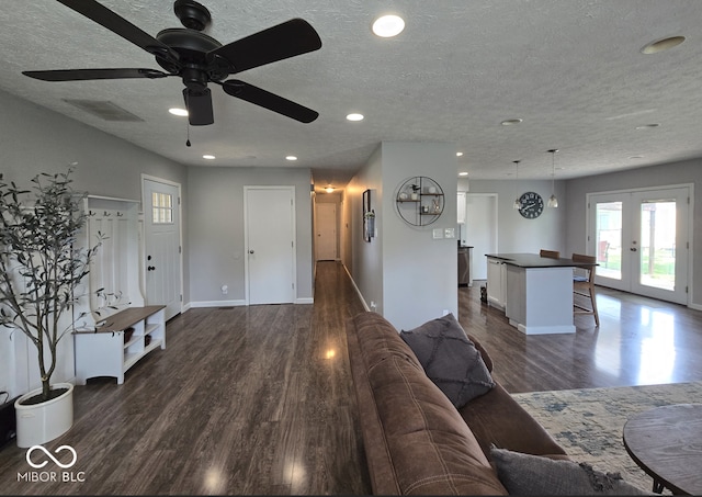 8401 Culpeper Dr, Indianapolis, IN 46227 - living area with dark wood-style flooring, french doors, a ceiling fan, a textured ceiling, and recessed lighting