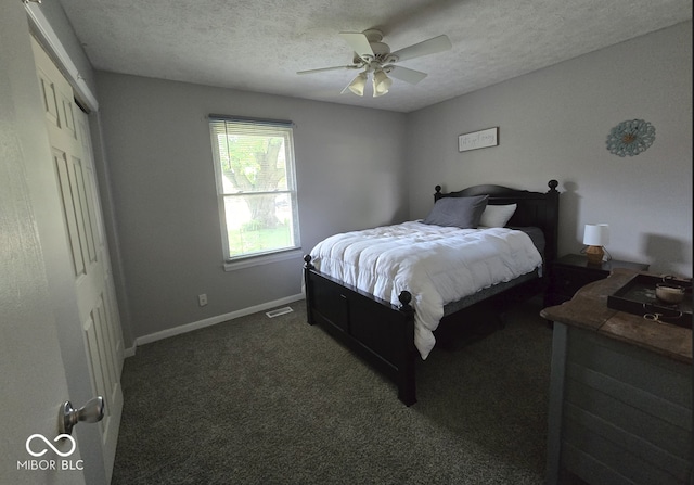 8401 Culpeper Dr, Indianapolis, IN 46227 - bedroom with dark carpet, a textured ceiling, and ceiling fan