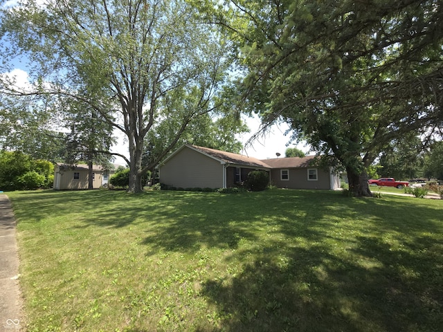 8401 Culpeper Dr, Indianapolis, IN 46227 - view of grassy yard featuring a shed