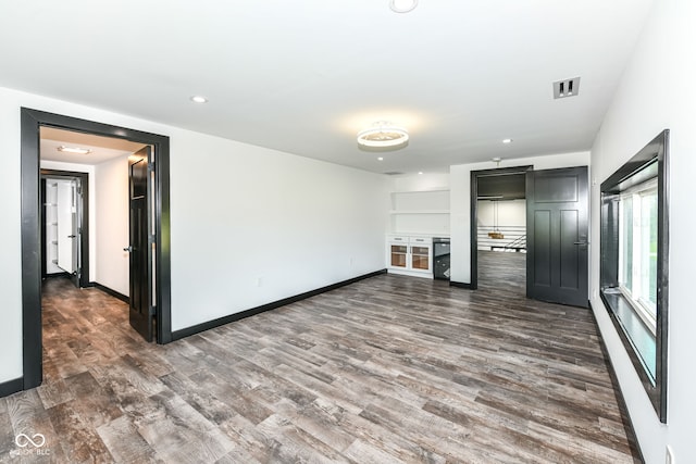 5400 E 200 S, Whitestown, IN 46075 - unfurnished living room featuring dark wood-type flooring and recessed lighting