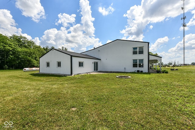 5400 E 200 S, Whitestown, IN 46075 - rear view of property with a lawn and an outdoor fire pit
