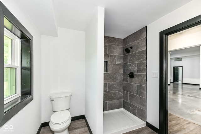 5400 E 200 S, Whitestown, IN 46075 - full bathroom with tiled shower, healthy amount of natural light, and wood finished floors