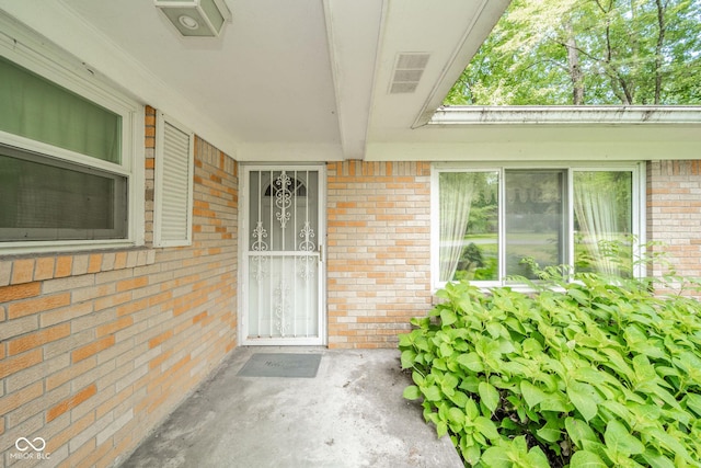 10104 Sycamore Ln, Indianapolis, IN 46239 - doorway to property with brick siding