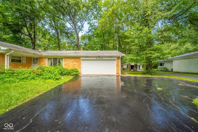 10104 Sycamore Ln, Indianapolis, IN 46239 - garage with asphalt driveway