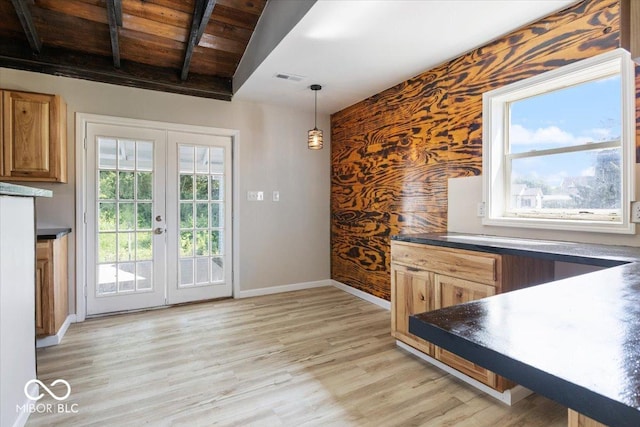 304 W Jefferson St, Kirklin, IN 46050 - unfurnished dining area with wooden ceiling, french doors, light wood finished floors, and an accent wall