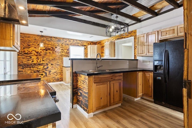 304 W Jefferson St, Kirklin, IN 46050 - kitchen featuring black fridge with ice dispenser, dark countertops, light wood-type flooring, decorative light fixtures, and brown cabinets