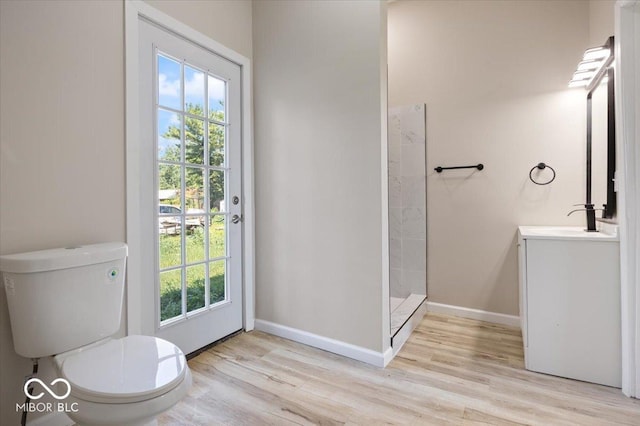 304 W Jefferson St, Kirklin, IN 46050 - full bath with wood finished floors, vanity, plenty of natural light, and tiled shower