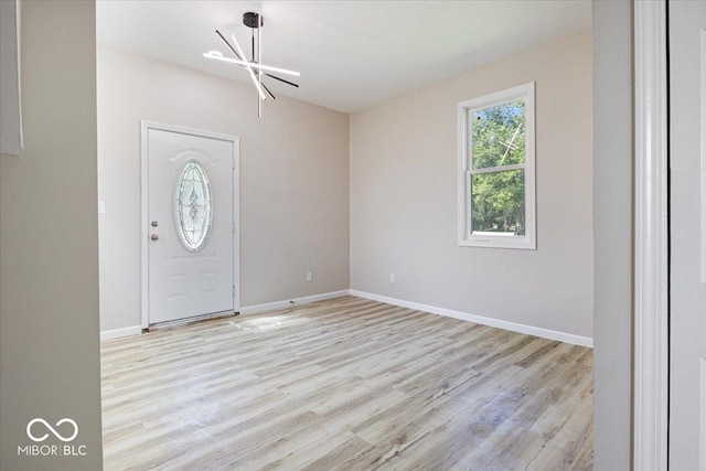 304 W Jefferson St, Kirklin, IN 46050 - foyer with a chandelier and light wood finished floors