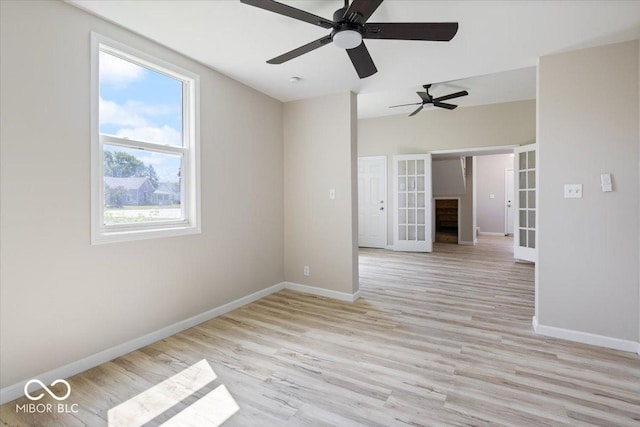 304 W Jefferson St, Kirklin, IN 46050 - spare room with french doors, wood finished floors, and ceiling fan