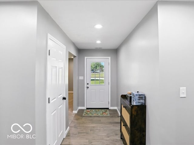 11093 N Pheasant Run, Fairland, IN 46126 - doorway to outside featuring wood finished floors and recessed lighting