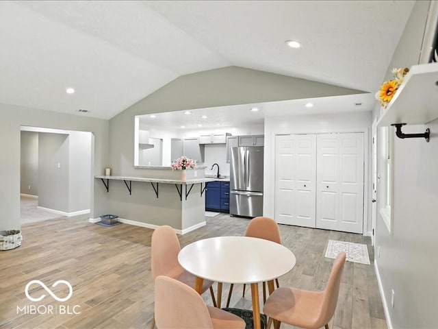11093 N Pheasant Run, Fairland, IN 46126 - dining space with lofted ceiling, light wood-style floors, and recessed lighting