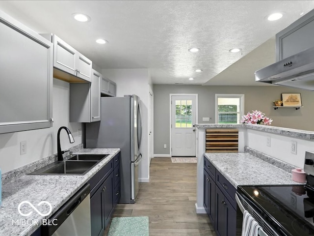 11093 N Pheasant Run, Fairland, IN 46126 - kitchen featuring stainless steel appliances, recessed lighting, light wood-type flooring, light countertops, and a textured ceiling