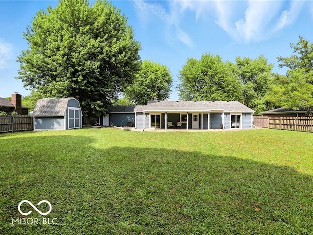 11093 N Pheasant Run, Fairland, IN 46126 - back of property featuring a storage unit, a fenced backyard, and a patio
