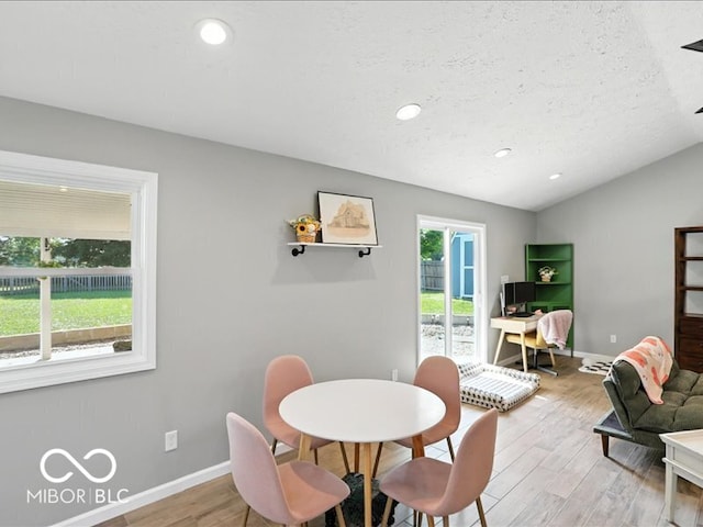 11093 N Pheasant Run, Fairland, IN 46126 - dining space with light wood finished floors, lofted ceiling, a textured ceiling, and recessed lighting