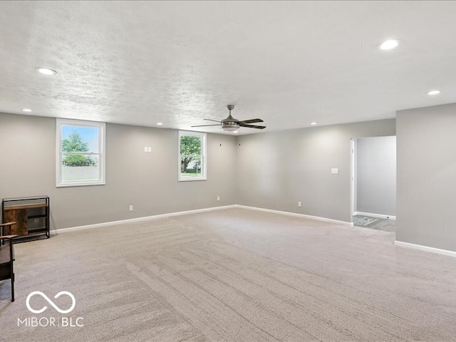 11093 N Pheasant Run, Fairland, IN 46126 - unfurnished living room featuring ceiling fan, recessed lighting, and light carpet