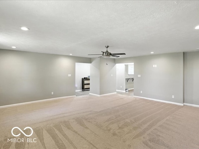 11093 N Pheasant Run, Fairland, IN 46126 - unfurnished living room featuring recessed lighting, light carpet, a ceiling fan, and a textured ceiling