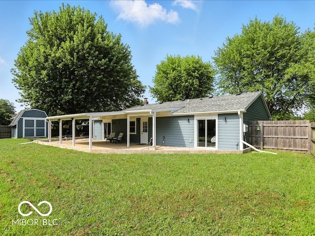 11093 N Pheasant Run, Fairland, IN 46126 - rear view of house with a patio, a storage shed, and a chimney