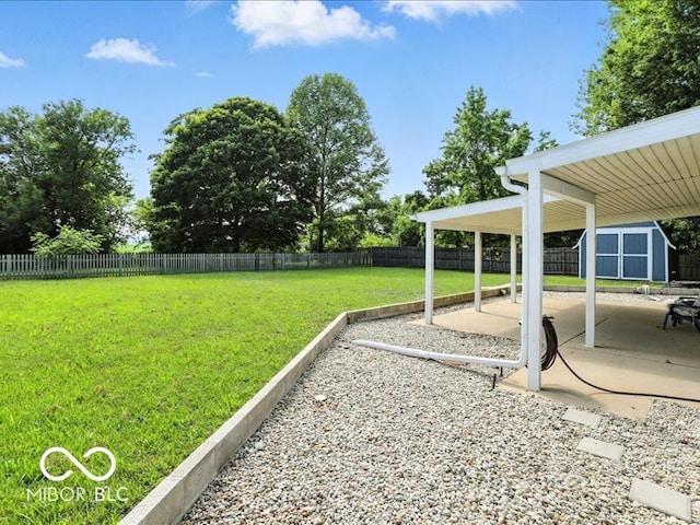 11093 N Pheasant Run, Fairland, IN 46126 - fenced backyard with a storage shed and a patio area