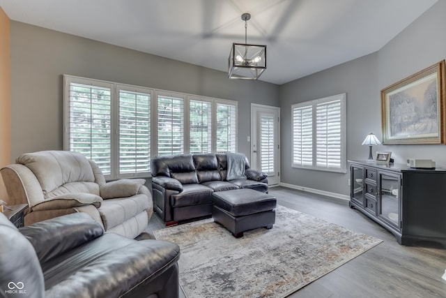 1454 Heron Ridge Blvd, Greenwood, IN 46143 - living area with light wood-style flooring and a chandelier