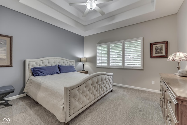 1454 Heron Ridge Blvd, Greenwood, IN 46143 - bedroom featuring carpet flooring, a tray ceiling, and a ceiling fan