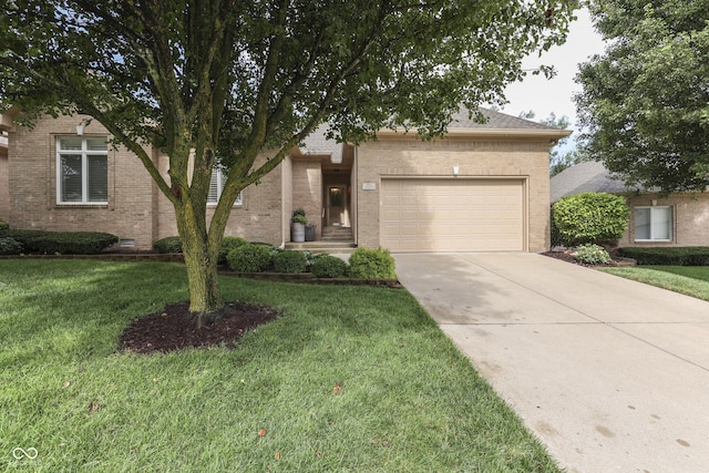 1454 Heron Ridge Blvd, Greenwood, IN 46143 - view of front of house featuring an attached garage, brick siding, driveway, and a front yard