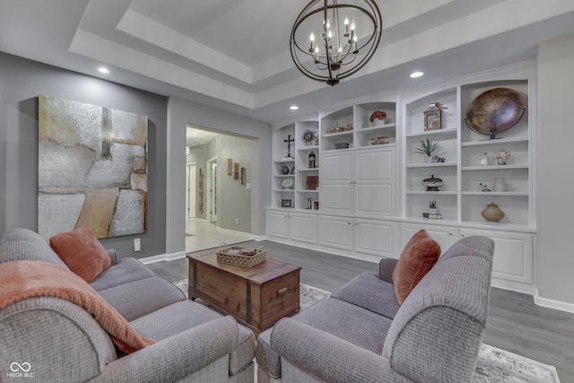 1454 Heron Ridge Blvd, Greenwood, IN 46143 - living area with a chandelier, wood finished floors, recessed lighting, and built in shelves