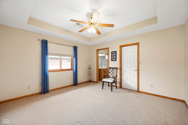 114 Asbury Dr, Anderson, IN 46013 - carpeted empty room with a tray ceiling and ceiling fan