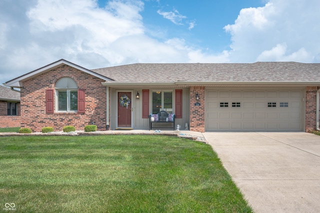114 Asbury Dr, Anderson, IN 46013 - single story home with brick siding, driveway, a front lawn, an attached garage, and roof with shingles