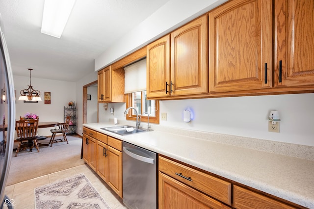 114 Asbury Dr, Anderson, IN 46013 - kitchen with stainless steel appliances, light countertops, light colored carpet, light tile patterned floors, and a chandelier